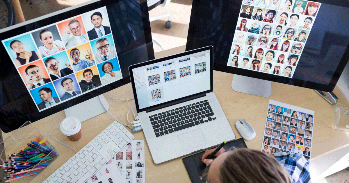 Three laptop screens with headshots of candidates all over them