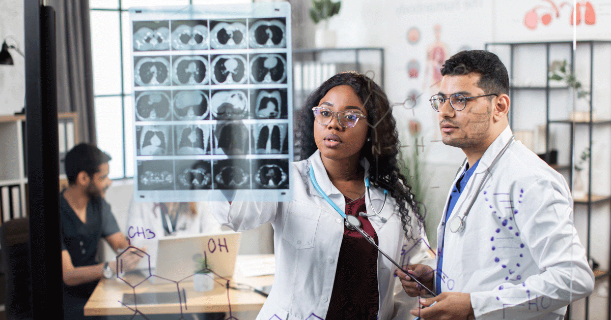 Nurse and doctor looking at x-ray