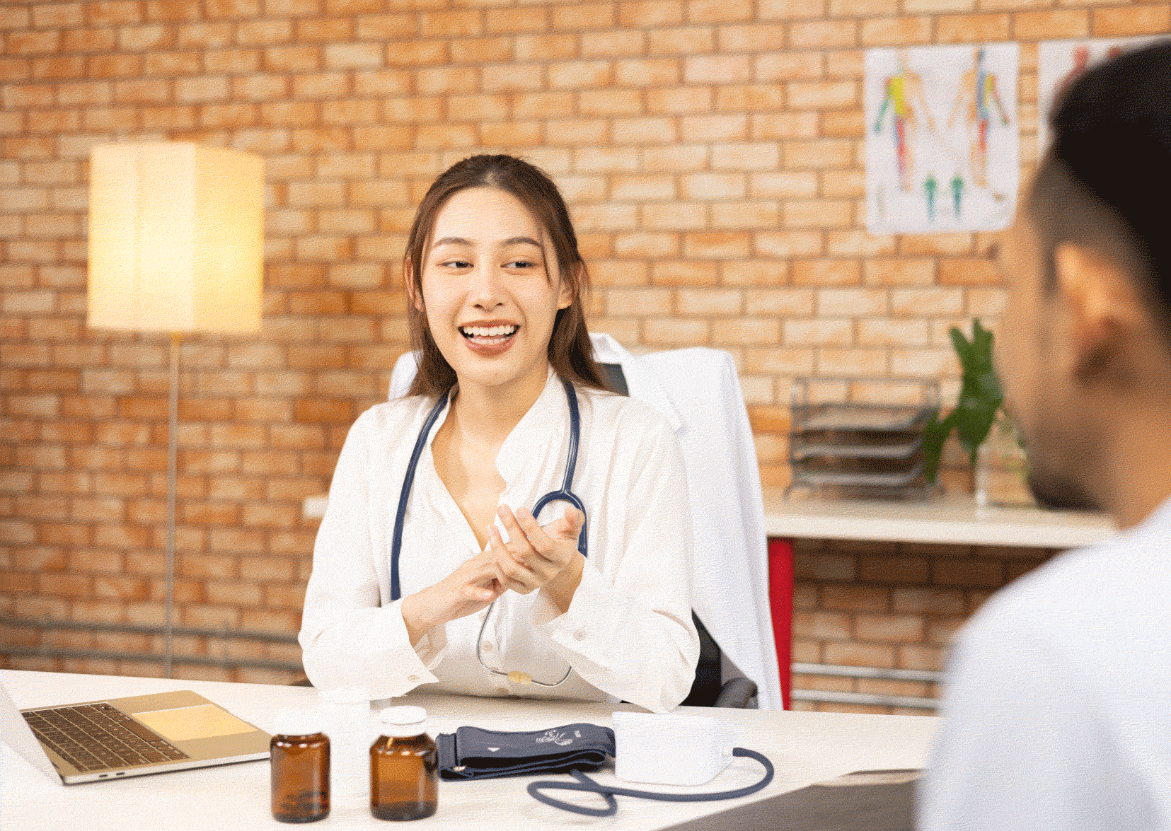 Nurse interviewing a man across a table