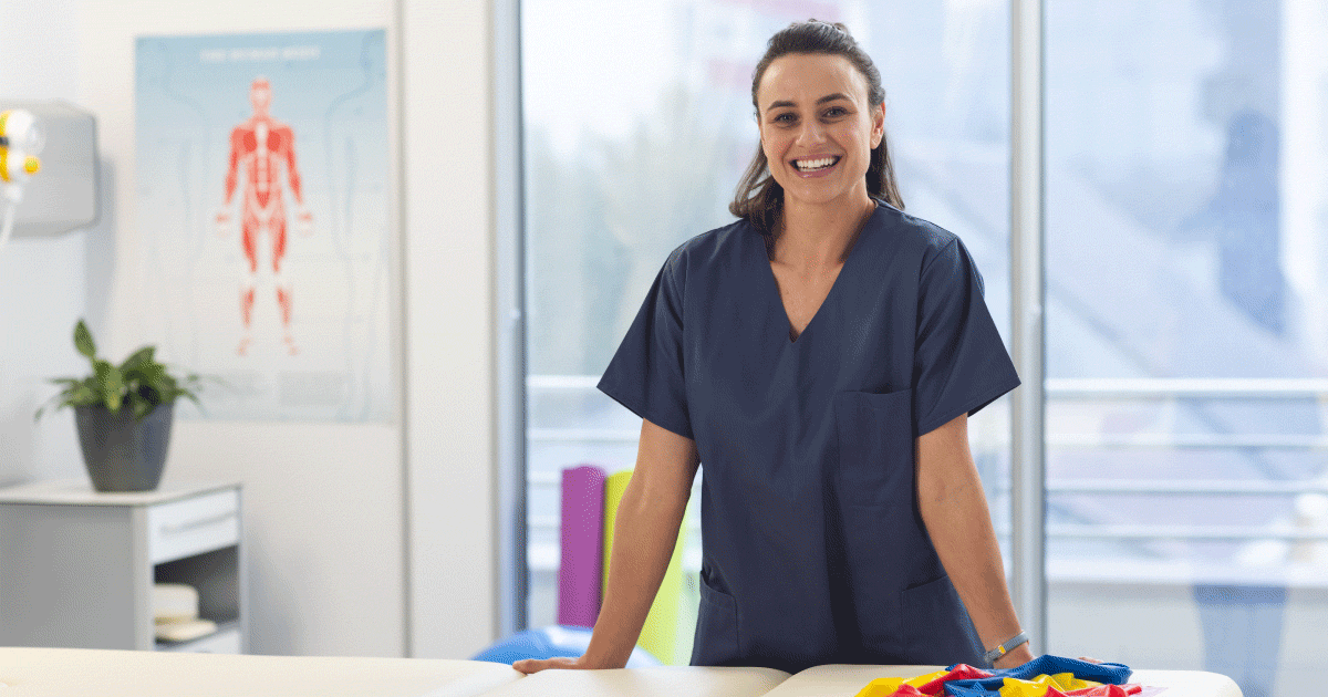 Physiotherapist in front of table