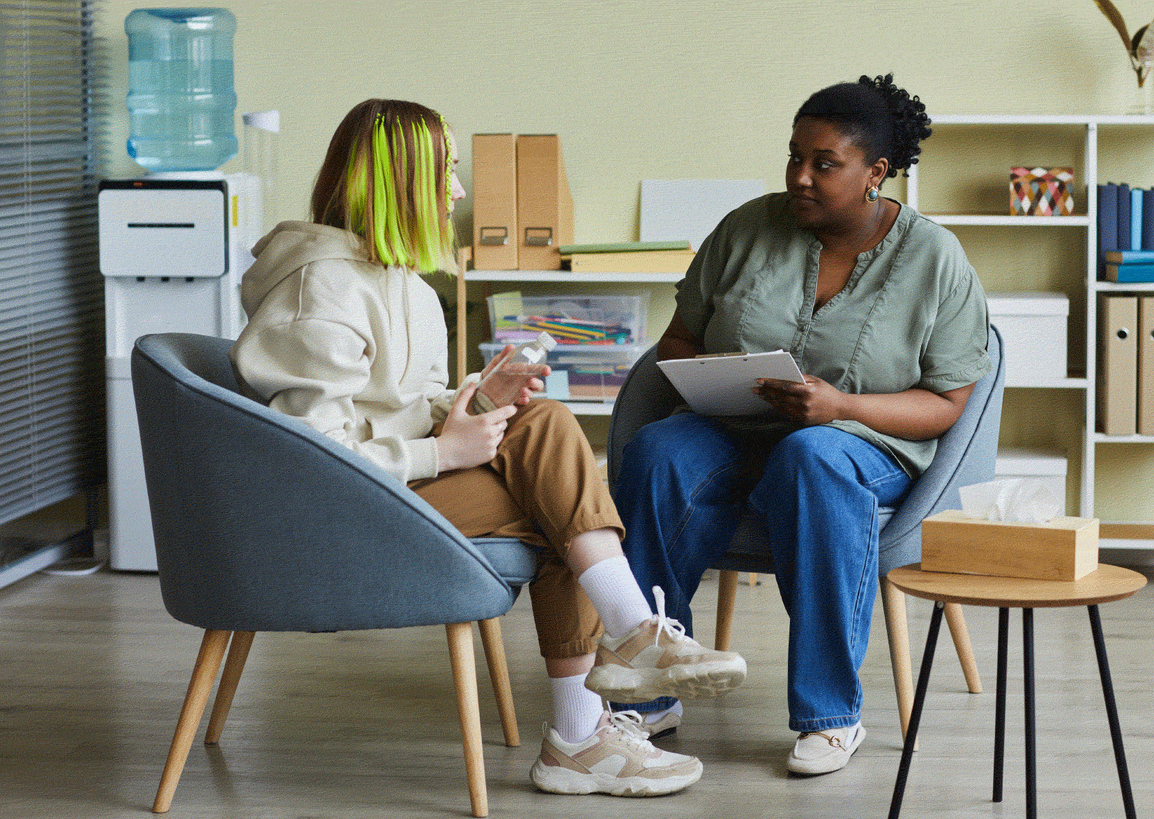 Mental health social worker speaking to a client