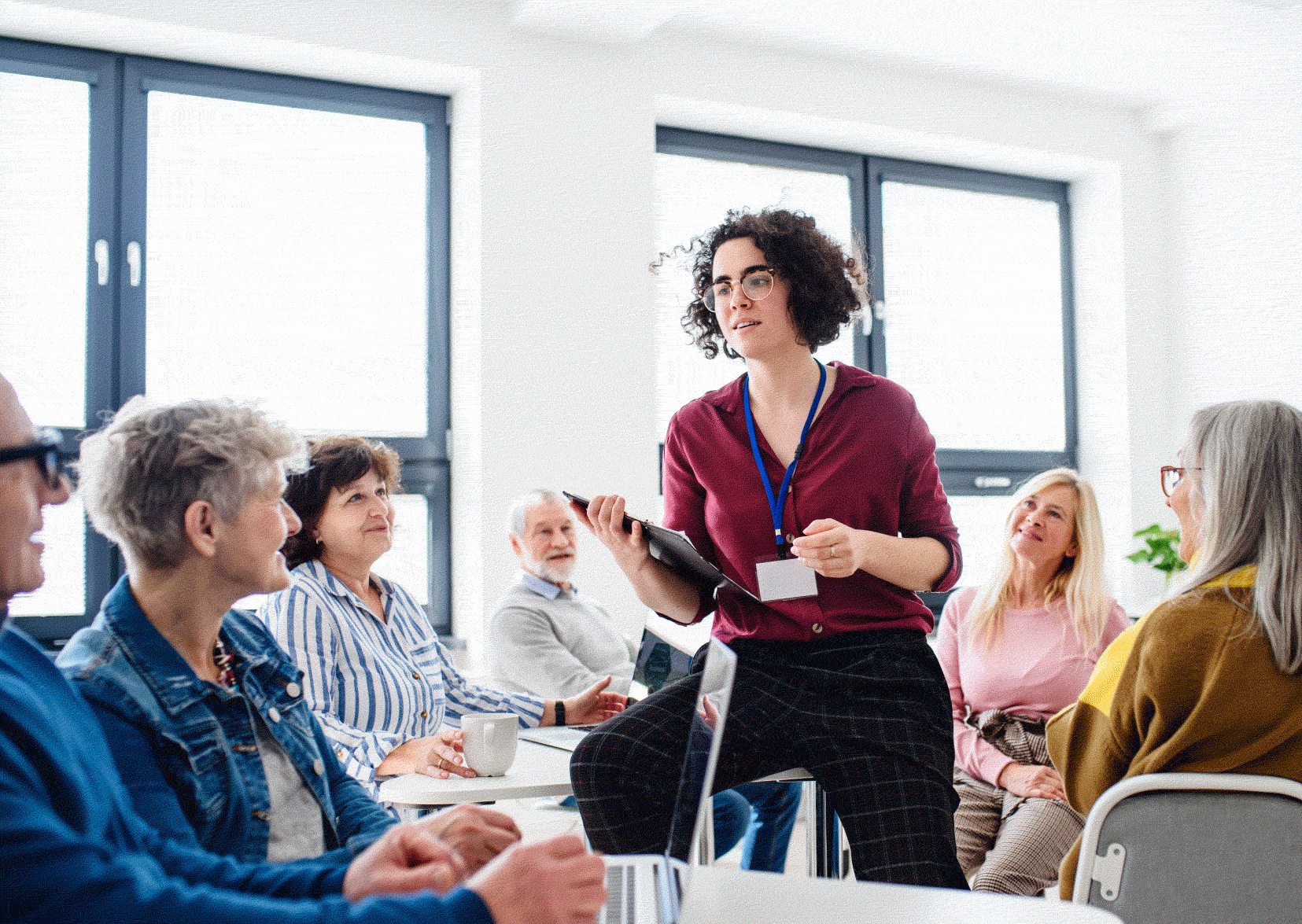 One lady stood up training a group of four people